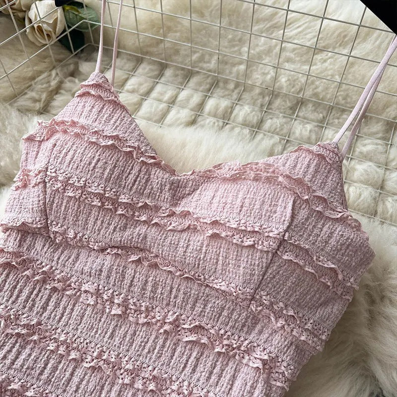 Light pink two-piece set with smocked top and tiered skirt