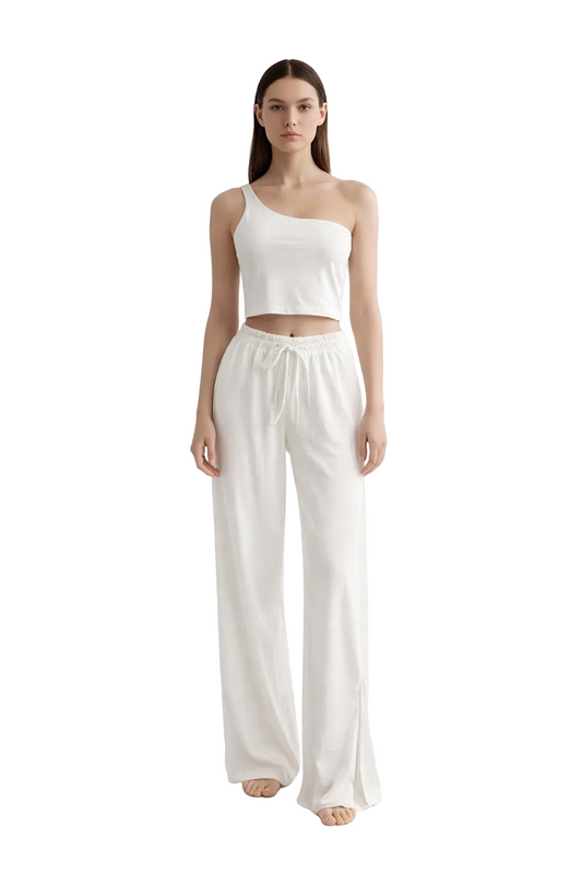 White one-shoulder cropped top and wide-leg trousers set
