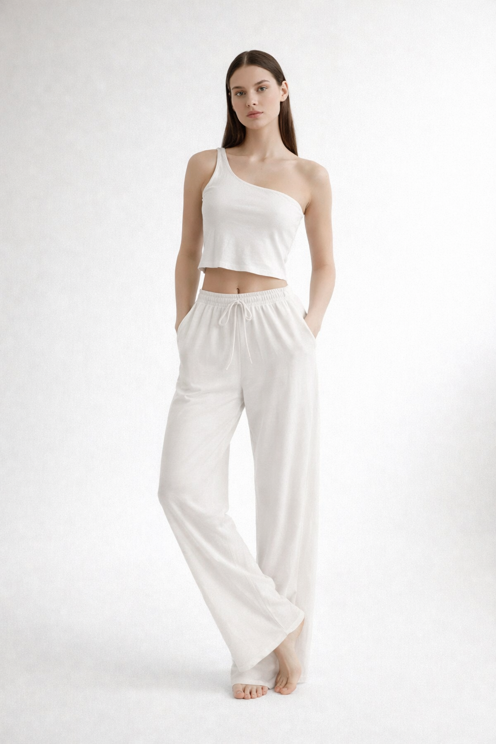 White one-shoulder cropped top and wide-leg trousers set