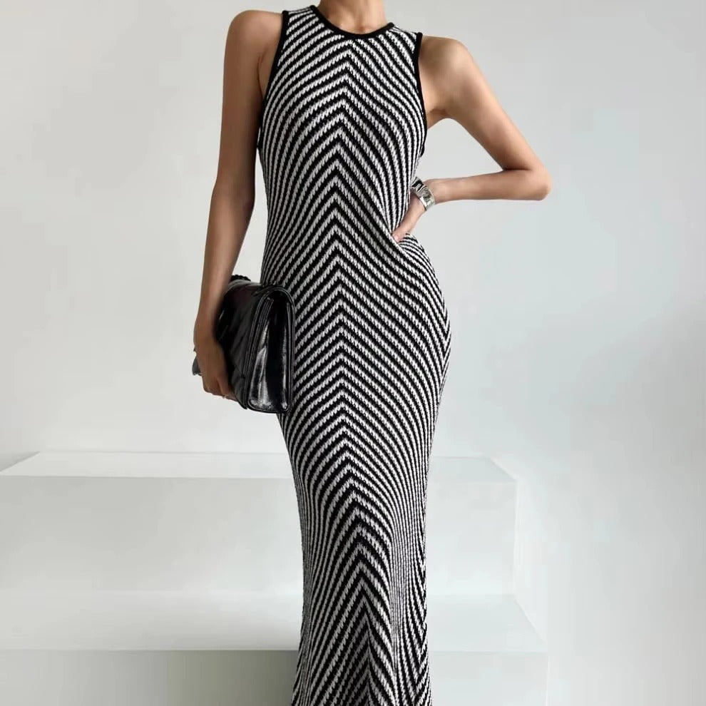 Black and white striped sleeveless maxi dress with high neckline