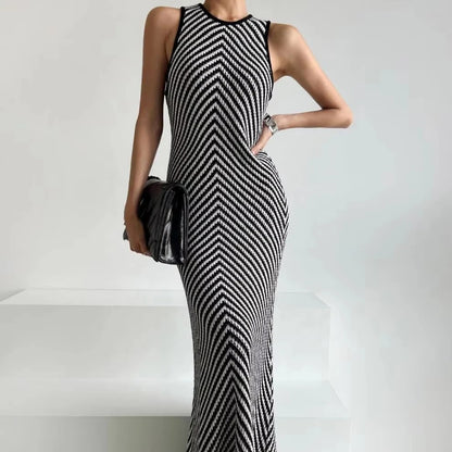 Black and white striped sleeveless maxi dress with high neckline