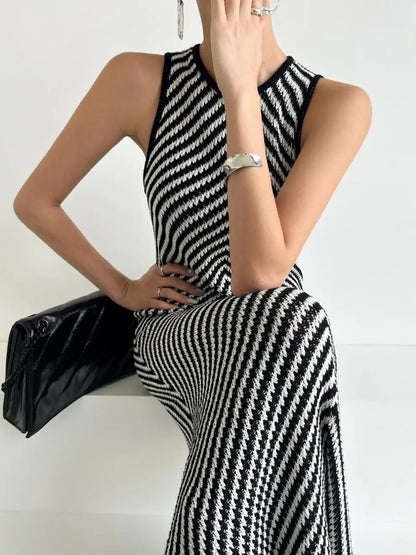 Black and white striped sleeveless maxi dress with high neckline