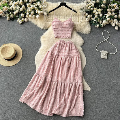 Light pink two-piece set with smocked top and tiered skirt