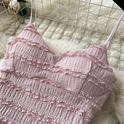 Light pink two-piece set with smocked top and tiered skirt